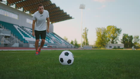 Soccer-player-performs-outstanding-play-during-a-soccer-game-on-a-professional-outdoor-soccer-stadium.-Player-wears-unbranded-uniform.-Stadium-and